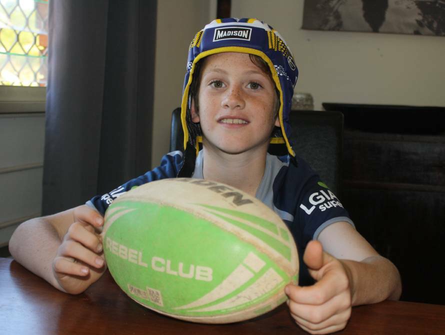 PROUD AS PUNCH: Cohen Jarrett of Katherine in the NT from back in 2017 with the headgear worn by the great man himself, Johnathan Thurston.