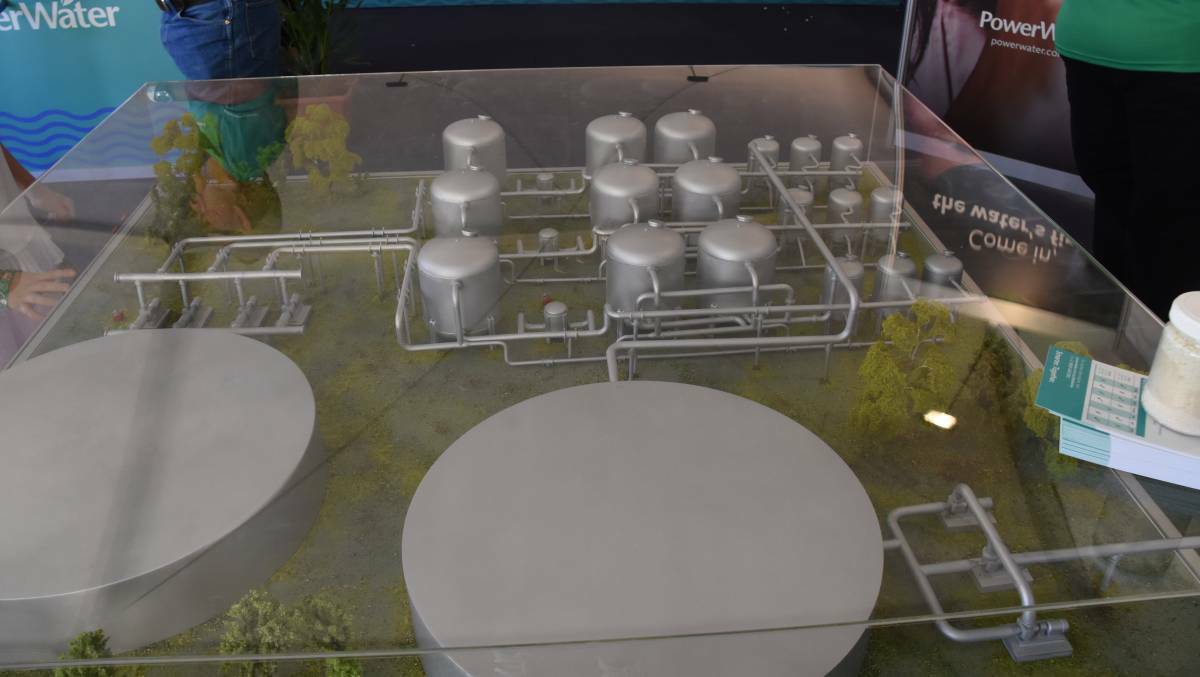 The model of the planned water treatment plant with the big tanks in the foreground.