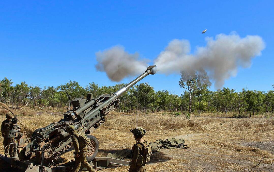 FIRE AWAY: Terrific picture of a round leaving a howitzer's barrel during training exercises at Mount Bundey. Pictures: Defence Media.