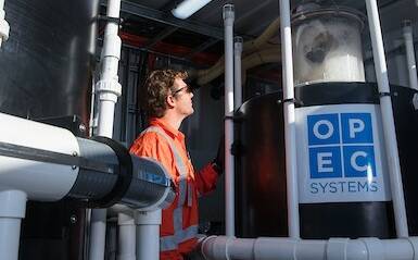 OPEC Systems technician, James Montefiore, observes foam fractionation in action at Oakey, Qld. PFAS contaminates have an inbuilt tendency to foam when aerated.