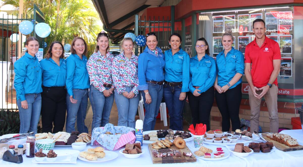 SUPPORTING THE CAUSE: Elders Real Estate Katherine team with Kate Everett and Tim for the REA Group. Photo: Supplied