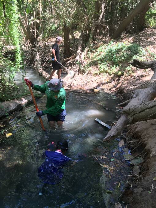 Good job: Flexible Learning and Engagement Centre students clean up the hot springs.