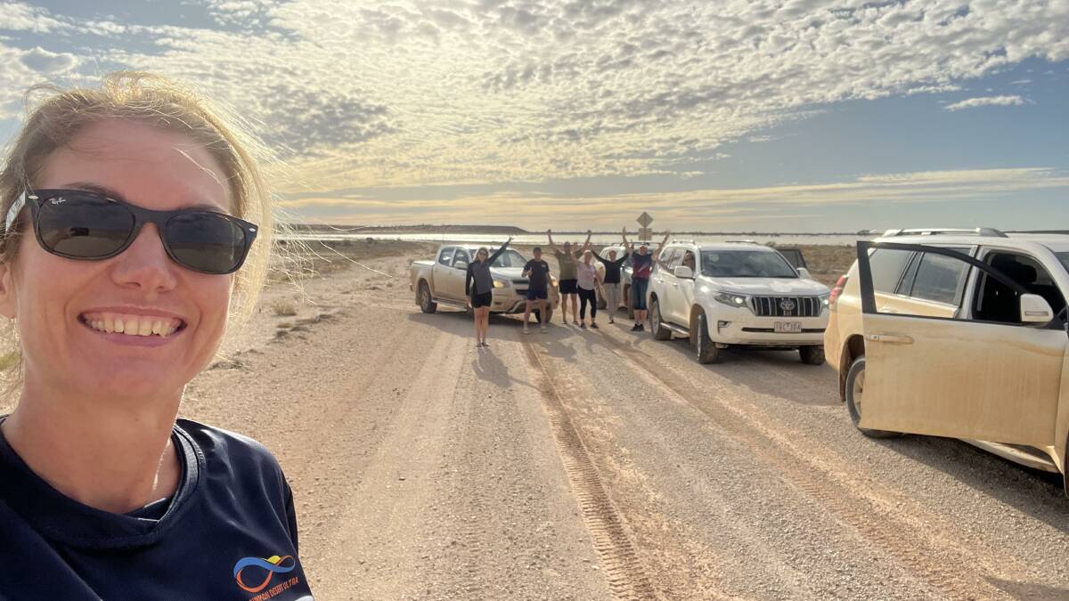 Chelsea and fellow runners celebrate passing the last obstacle, a Diamantina River breakout 15km east of Birdsville. Picture: supplied