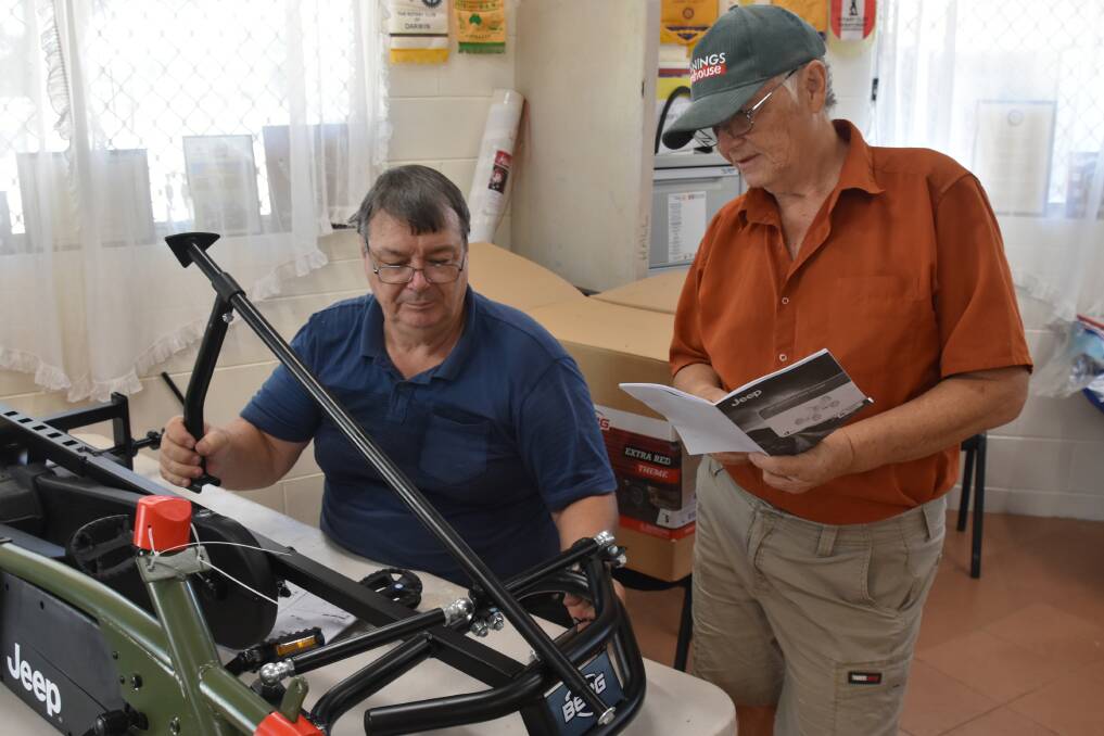 Andrew Highet (seated) and Chris Dixon assembling one of the smaller pedal cars