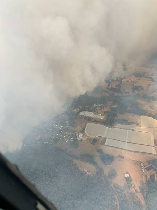 SMOKING: An aerial view of Batlow apple orchards on fire on January 5. 