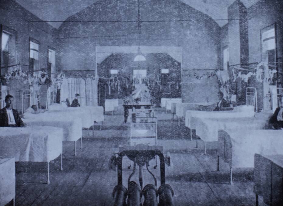 RECOVERING SOLDIERS: The men's ward at Armidale Hospital, circa 1916. It was customary for rural women to pick and arrange flowers for patients in hospital wards.