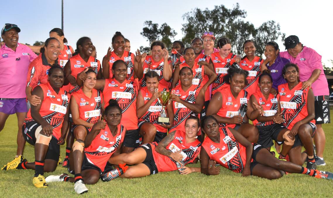 Tiwi Bombers celebrate their dominant Grand Final win on Saturday. Photo: Tom Robinson. 