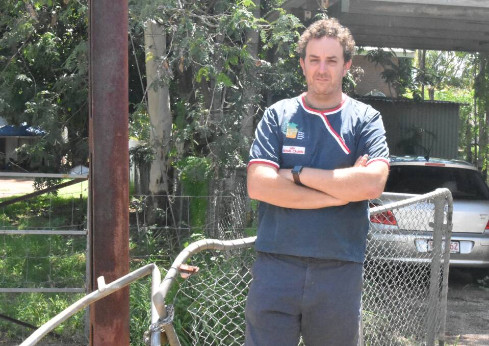 Alex Burleigh stands next to his damaged gate, which was destroyed by two allegedly stolen vehicles. Picture: Tom Robinson. 