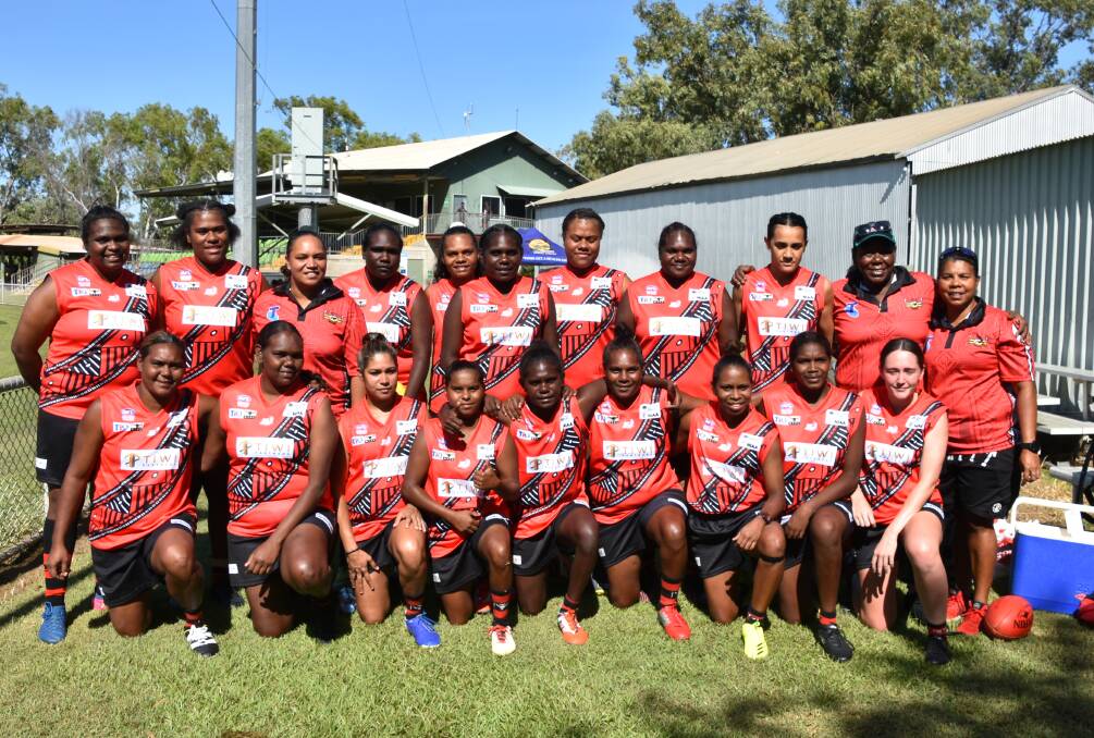 The Tiwi Bombers women before their first game on Saturday. Photo: Tom Robinson. 