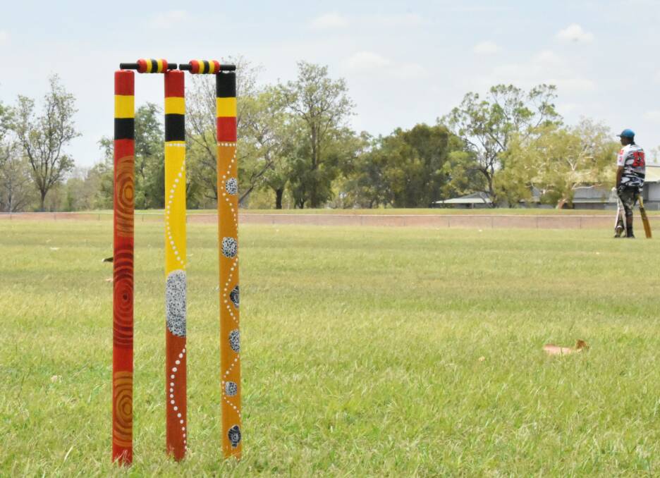 Cricket stumps designed by May Rosas telling ancient stories about Katherine. 