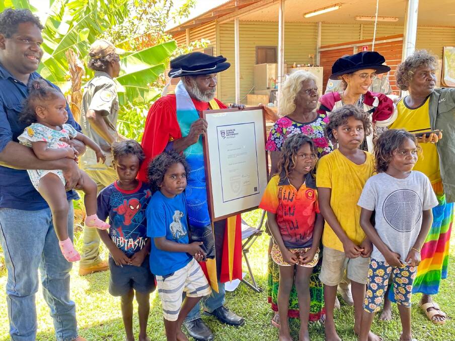 HONOUR: Dr Bulmaniya with at the ceremony surrounded by friends and famkly. Image: Supplied