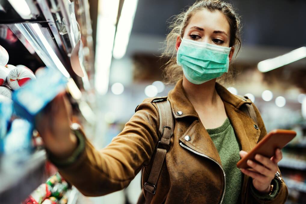 MASKING UP: You can still shop for groceries, but make sure you wear your mask properly, not around your chin. Image: Shutterstock