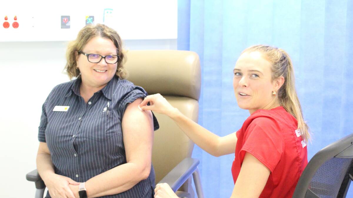 Katherine Hospital ED Clinical Nurse Manager Leanne Chapman received her second dose of the Pfizer vaccine by vaccinator Alexandra Hinchcliff. Photo supplied.