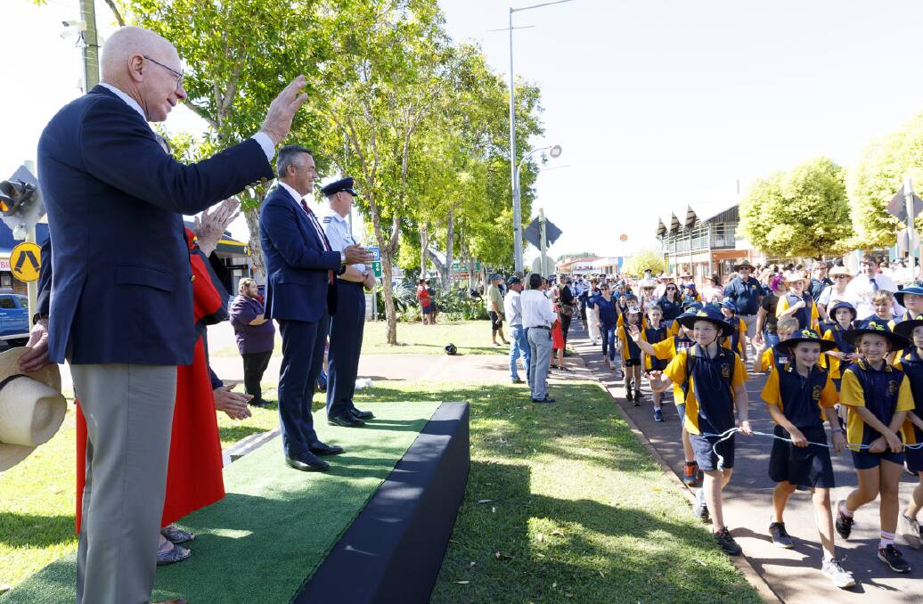 Governor General David Hurley waves to school children during the Anzac Day march. Photo supplied.