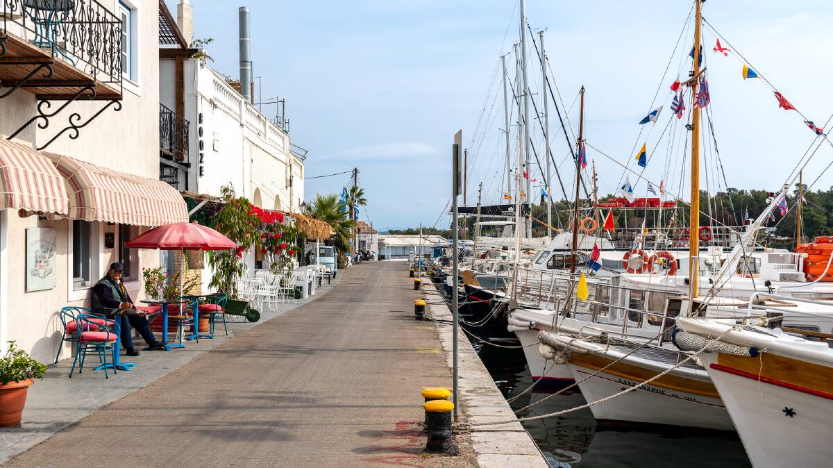 Yachts moored opposite restaurants on the trendy island of Spetses.
