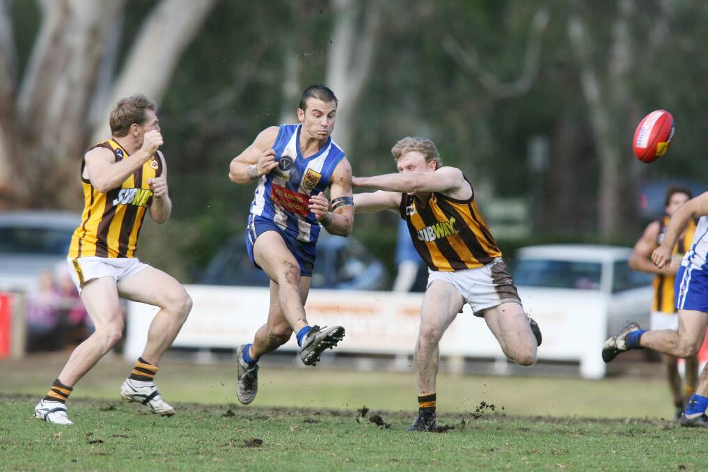 Jake Ryan clears the ball while playing for the Roos against Wangaratta Rovers in his debut year of 2007. A shoulder injury ended his season in round 12.