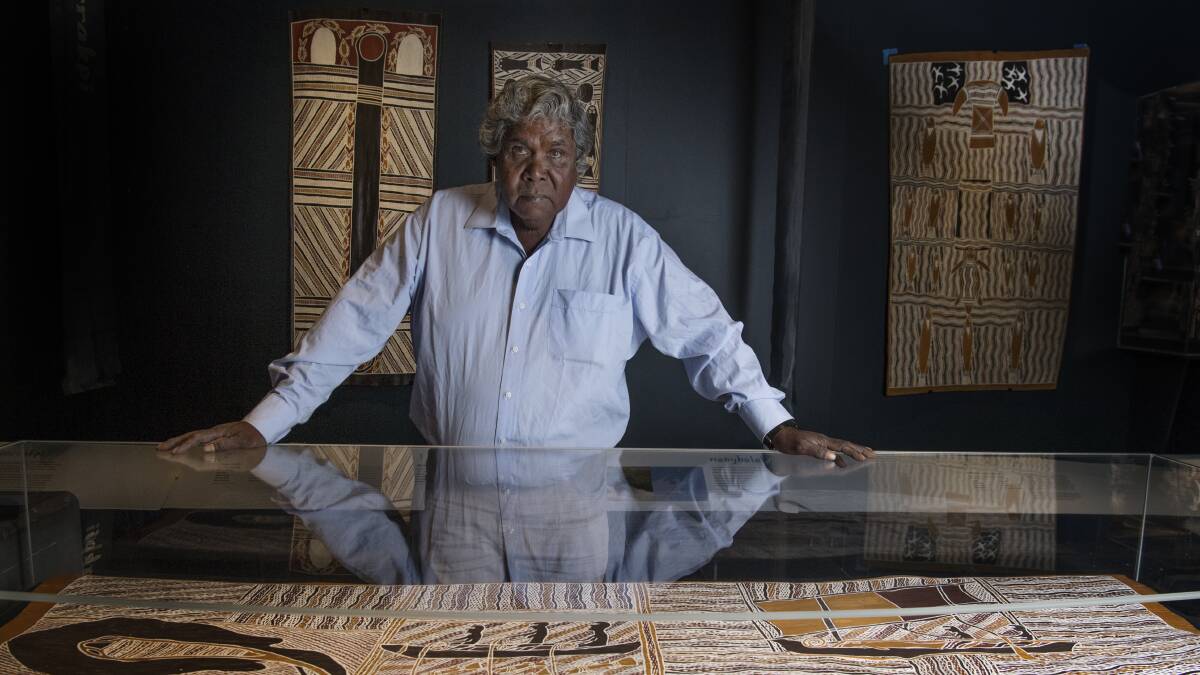 Djambawa Marawili, a Yolngu clan leader and artist with one of his artworks on display at the Australian National Maritime Museum. Photo: Louise Kennerley