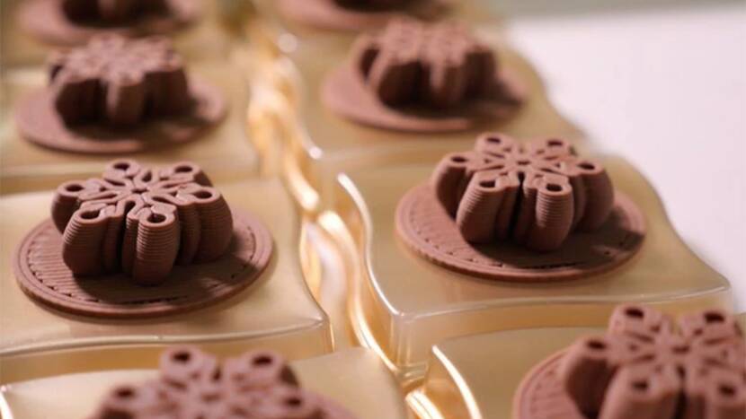 Milk chocolate charms in 3D. 