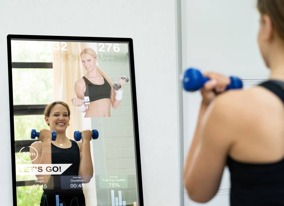 MIRROR MIRROR: The Vault and its iFit interactive tech bring famous gurus into your lounge room and takes you to exotic locations while you train. Picture: Shutterstock. 