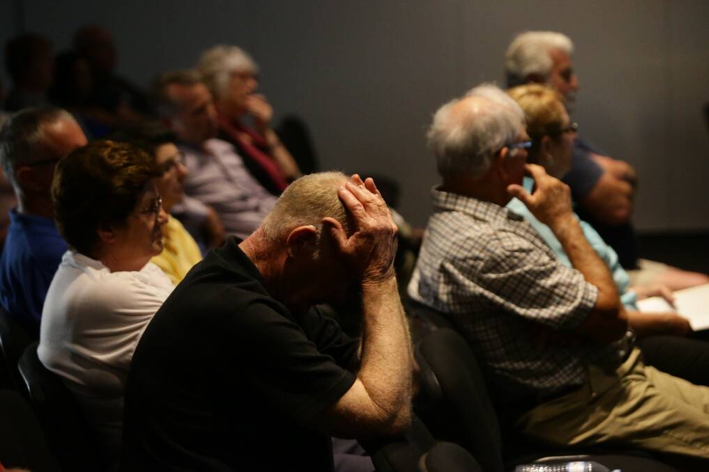 FRUSTRATING: A man hangs his head as residents run out of patience during a briefing on the findings of an expert health panel for PFAS. Picture: Jonathan Carroll