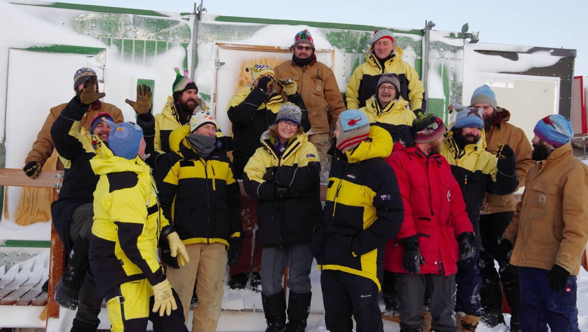 Hadley's hats: Mawson expeditioners proudly wearing their beanies. Photo: Dan Broun/Australian Antarctic Division
