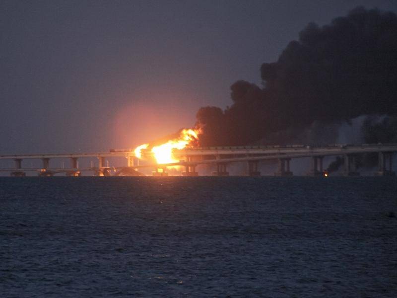 Russian officials say three people have been killed after a truck blew up on a Crimean bridge. (AP PHOTO)
