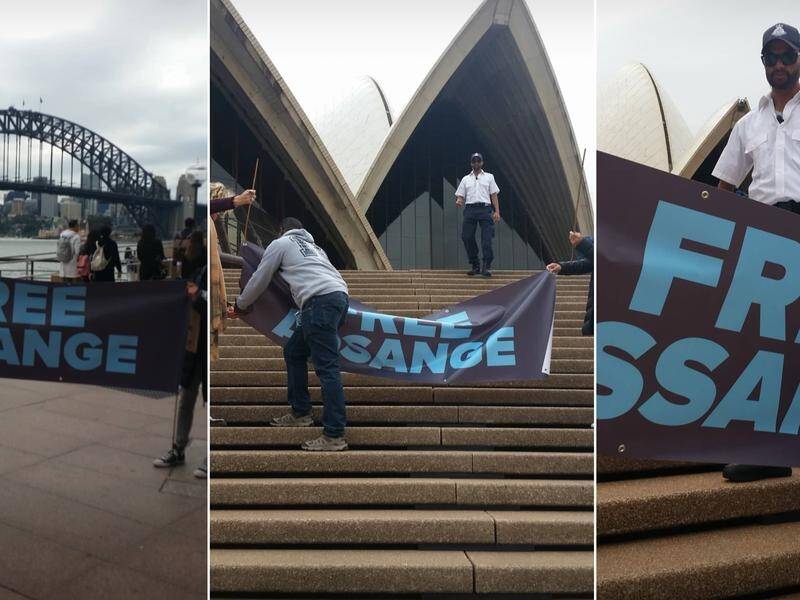 Julian Assange supporters are quickly moved on from the steps of the Sydney Opera House.