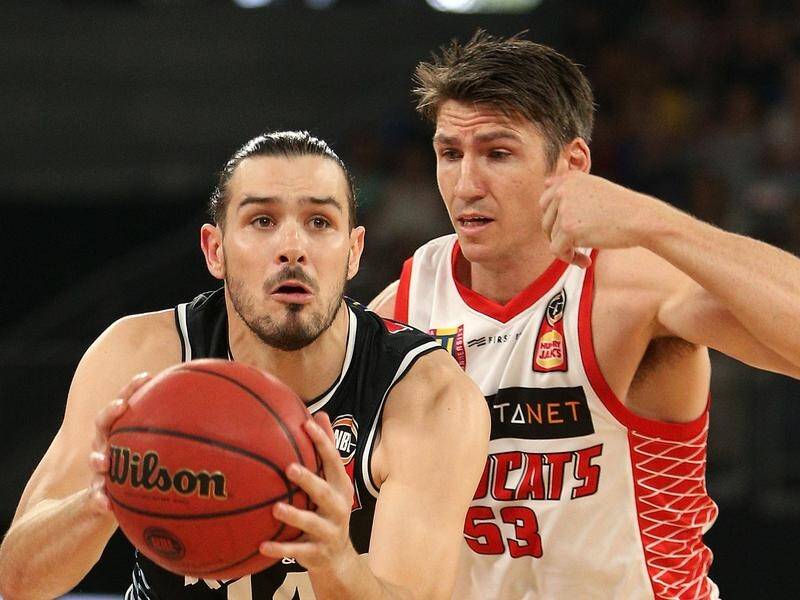 Chris Goulding's (L) two overtime three-pointers have given Melbourne an 81-70 NBL win over Perth.