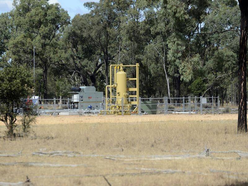 Gas producer Santos and an NT cattle firm have agreed to end their onshore gas fracking court fight.
