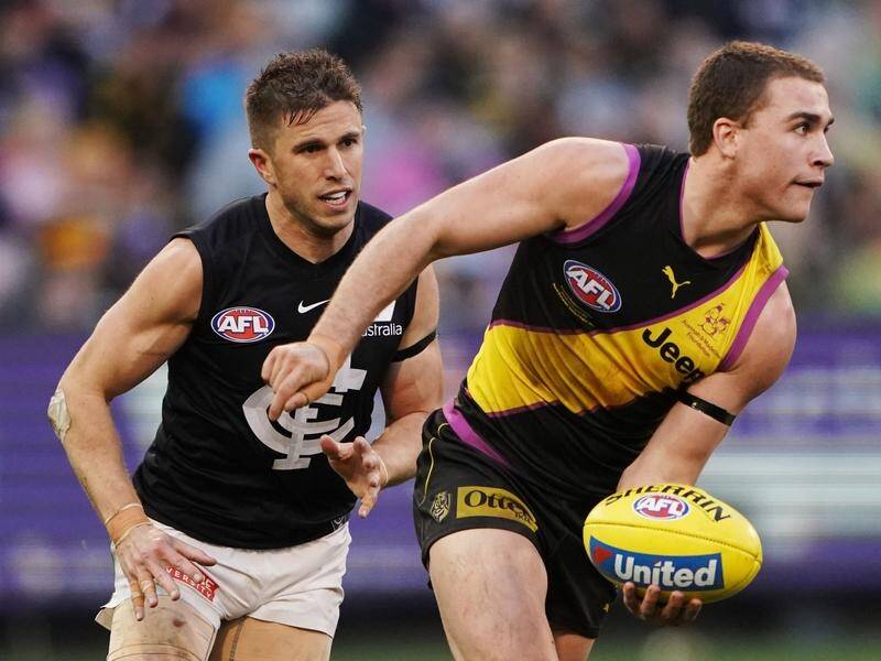 Jack Ross (r) could be one of two Tigers who miss out on AFL and VFL grand finals.