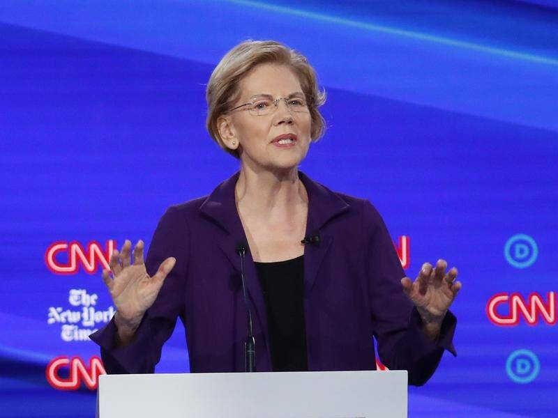 US Democratic presidential hopeful Elizabeth Warren won't say how she will pay for universal health.