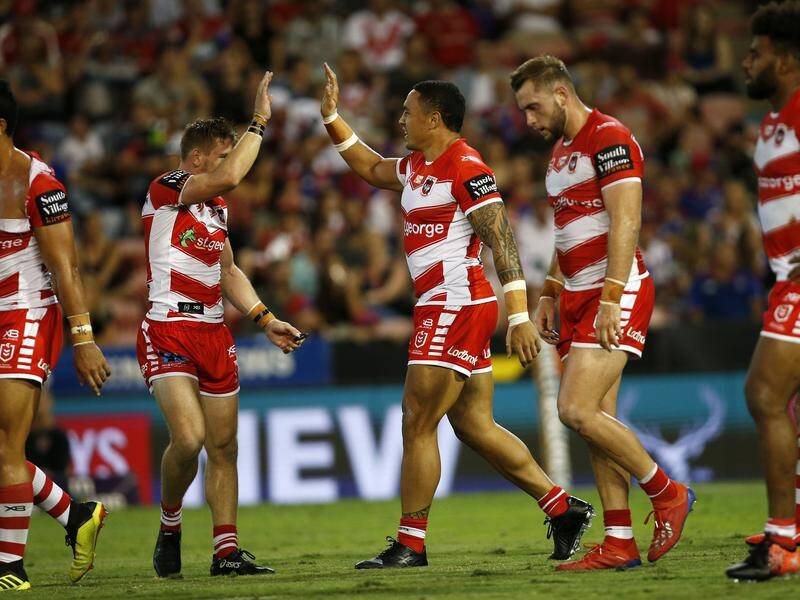 Tyson Frizell (centre) celebrates his try for the Dragons after recovering from a freakish injury.