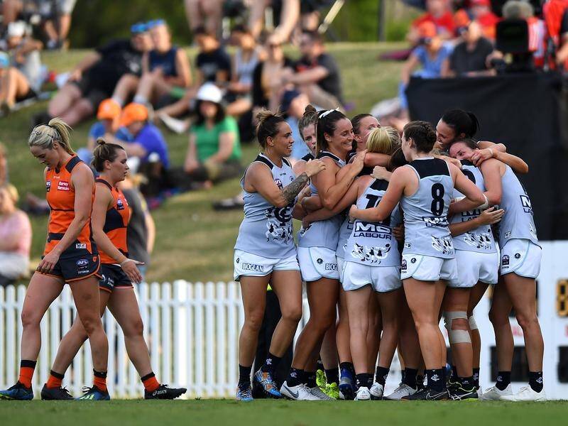 Carlton celebrate their first AFLW win of the season after beating GWS in Sydney.