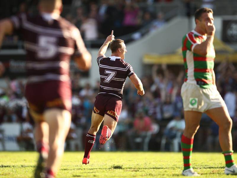 Manly's Daly Cherry-Evans (C) has kicked the golden point-winning field goal against South Sydney.