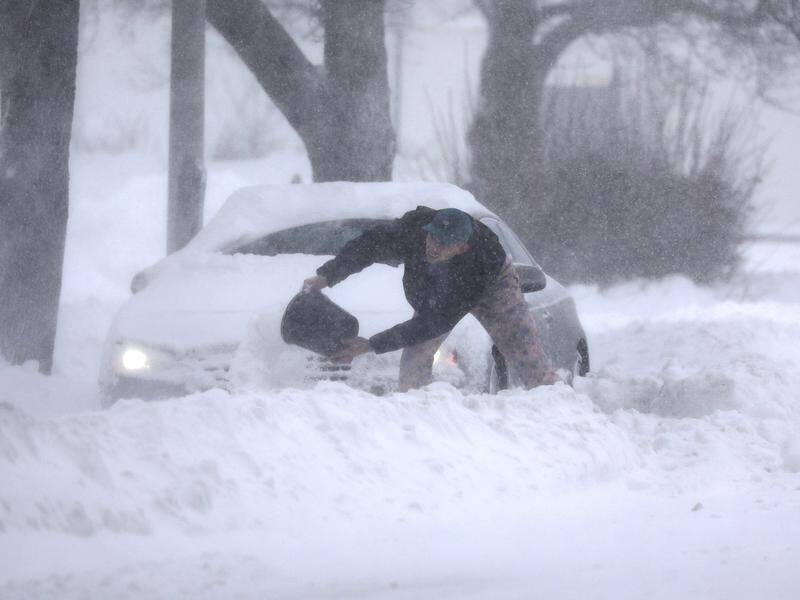 Officials urged residents to stay off snowy roads in the eastern US.