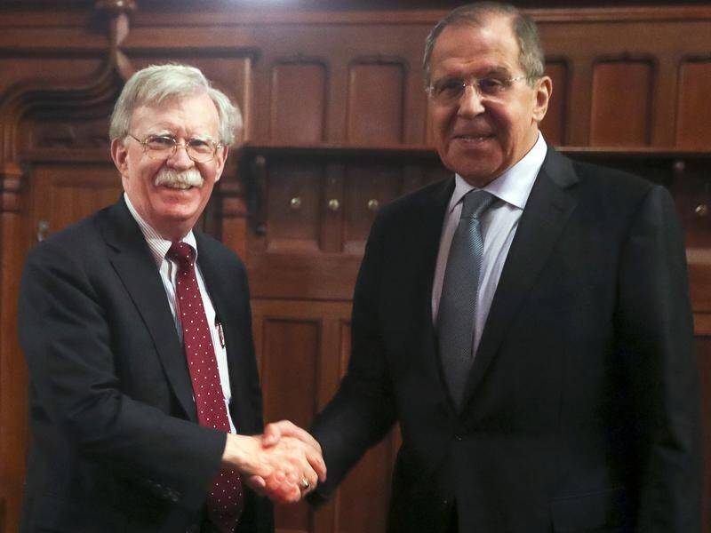 US National Security Adviser John Bolton (L) and Russian Foreign Minister Sergey Lavrov in Moscow.