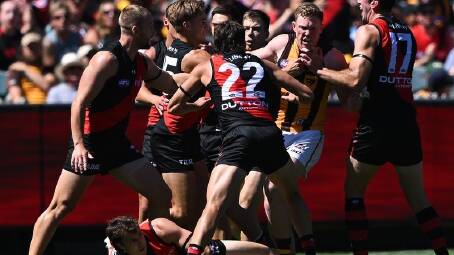 Hawthorn's James Sicily (2nd r), seen here scuffling with Essendon players, has avoided suspension. (James Ross/AAP PHOTOS)