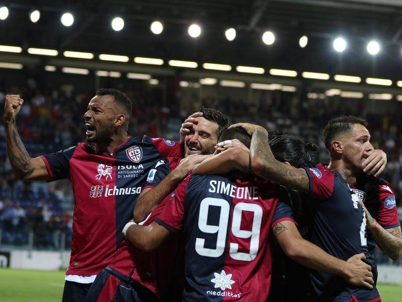 Giovanni Simeone (C) has scored in a Cagliari's 3-1 Italian Serie A win over Genoa.