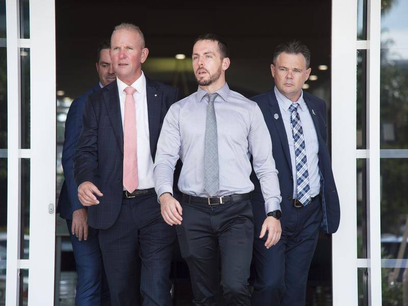 The Crown says Zachary Rolfe (centre) lied about Kumunjayi Walker touching the constable's pistol.