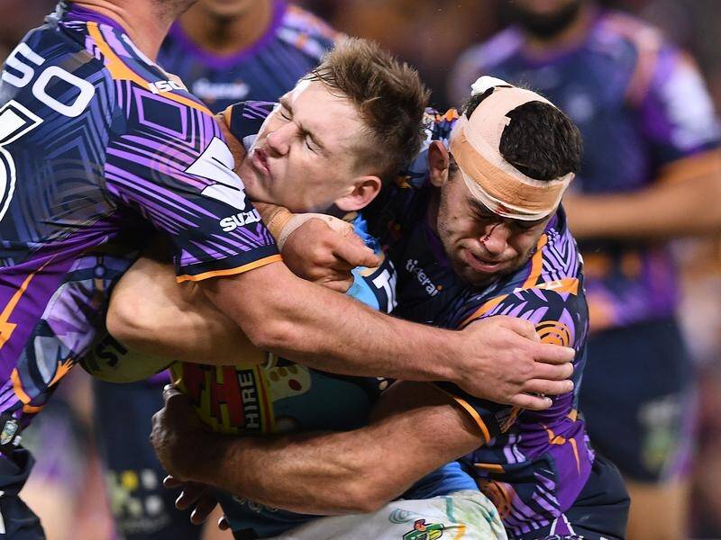 Dale Finucane (right) is familiar with wrestling-style tackles since joining the Melbourne Storm.