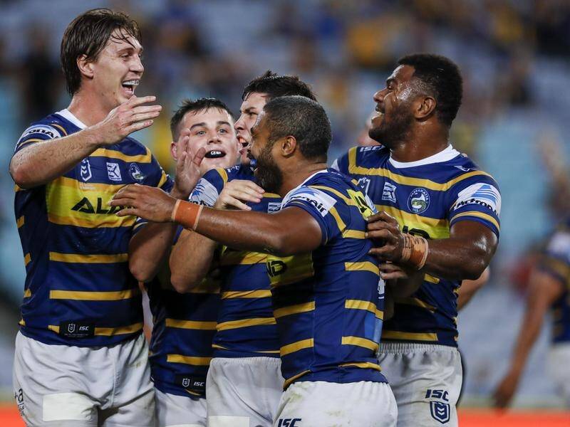Mitchell Moses (C) has set up two Michael Jennings (2R) tries in Parramatta's NRL win over Cronulla.