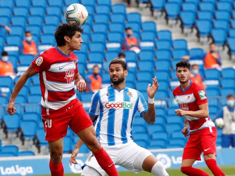 Real Sociedad have suffered a 3-2 defeat to Europa League qualification rivals Granada in Spain.