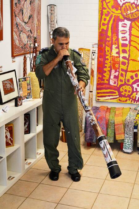 COMBINATION OF CULTURES: Saudi Arabian Lieutenant Colonel Nasser Mohammed Al Shahrani tries his hand at playing the didgeridoo.