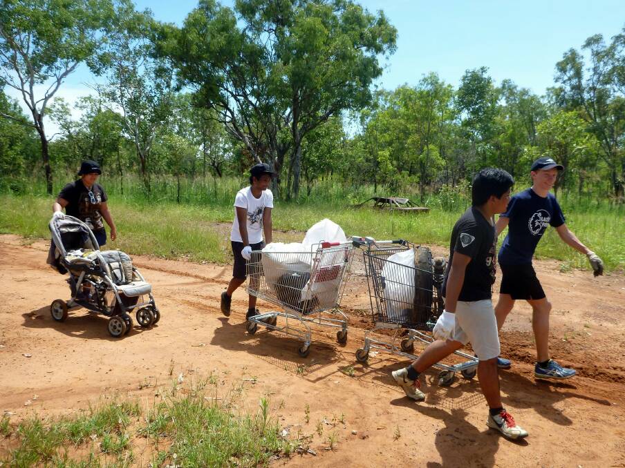 COMMUNITY EFFORT: Community of Conservation and Activism members get their hands dirty as part of the group’s Clean Up Australia Day effort in the Katherine region on March 1.
