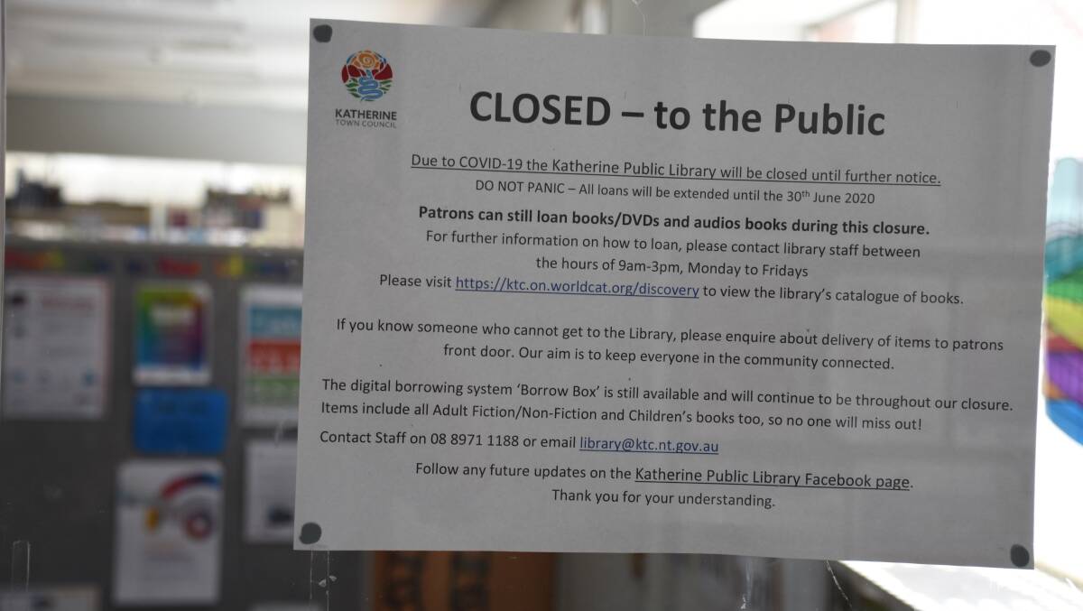 The notice posted on Katherine Library's front door explaining changes.