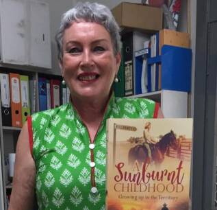 Toni Tapp Coutts with a copy of her memoir at the Katherine Museum.