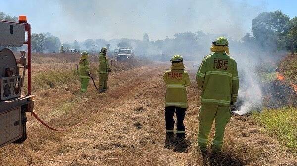 Firefighters monitoring a hazard-burn this month (Photo: PFES Media).