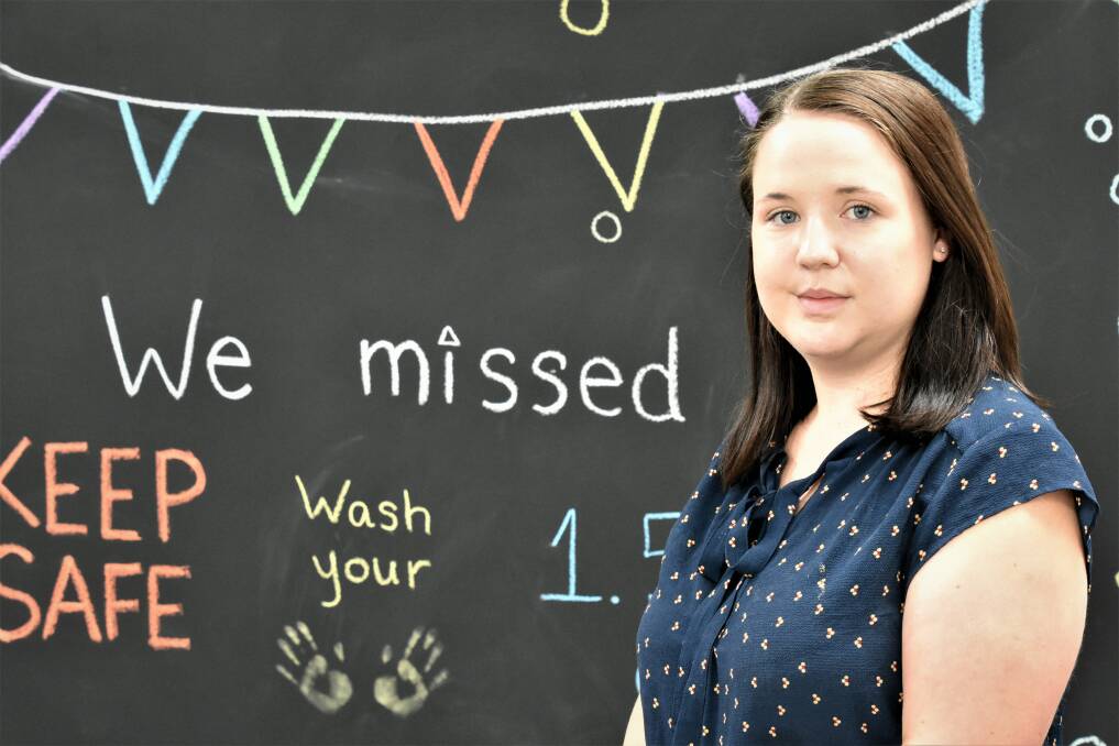 Acting Manager Kaitlin Biffin in front of the new Katherine library chalkboard.
