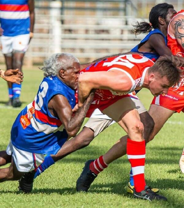 Keith Rogers showing textbook form after chasing down this young Crocs half-back in Katherine on Saturday. Picture: Casey Bishop.