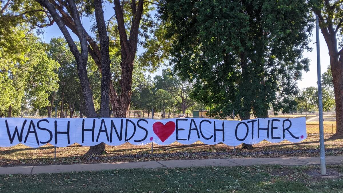 The sign included a reminder to love one another in these difficult times.